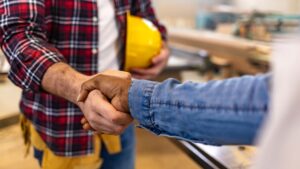 person shaking hands with contractor